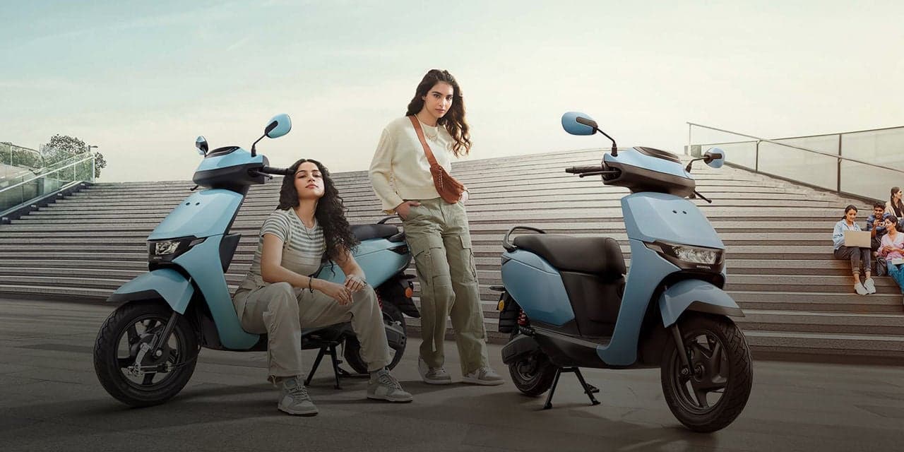 Honda QC1 Standard electric scooter exterior, front three-quarter view.