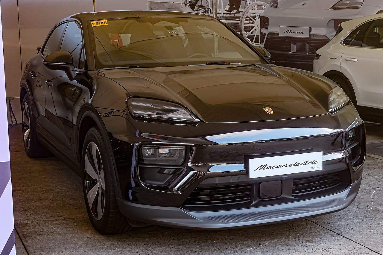 Porsche Macan Electric Standard electric SUV exterior, front three-quarter view.